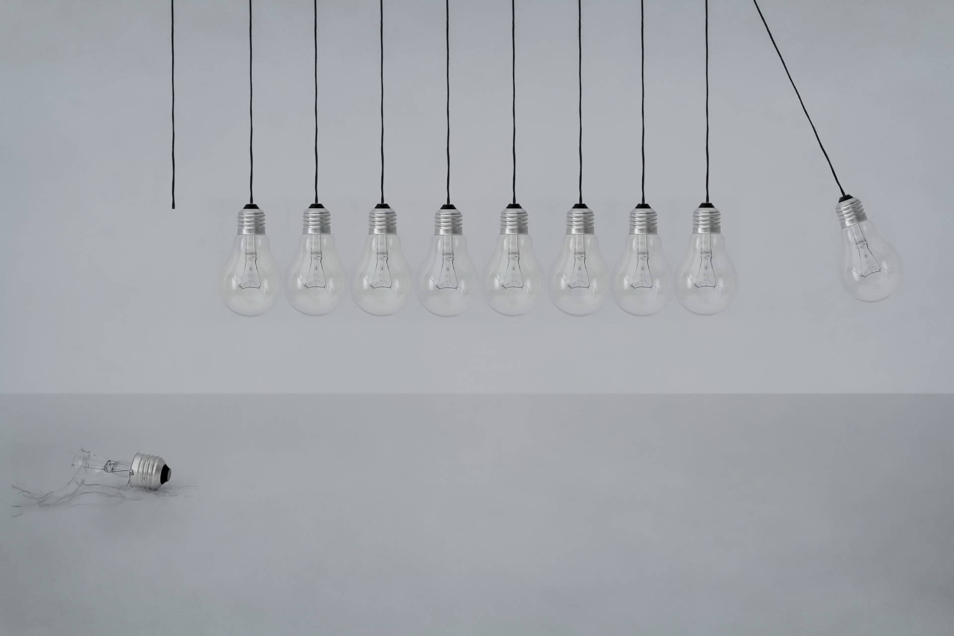 Swinging Transparent Light Bulbs Background