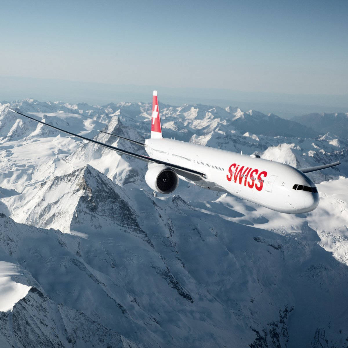 Swiss Airlines Over The Mountain Range Background