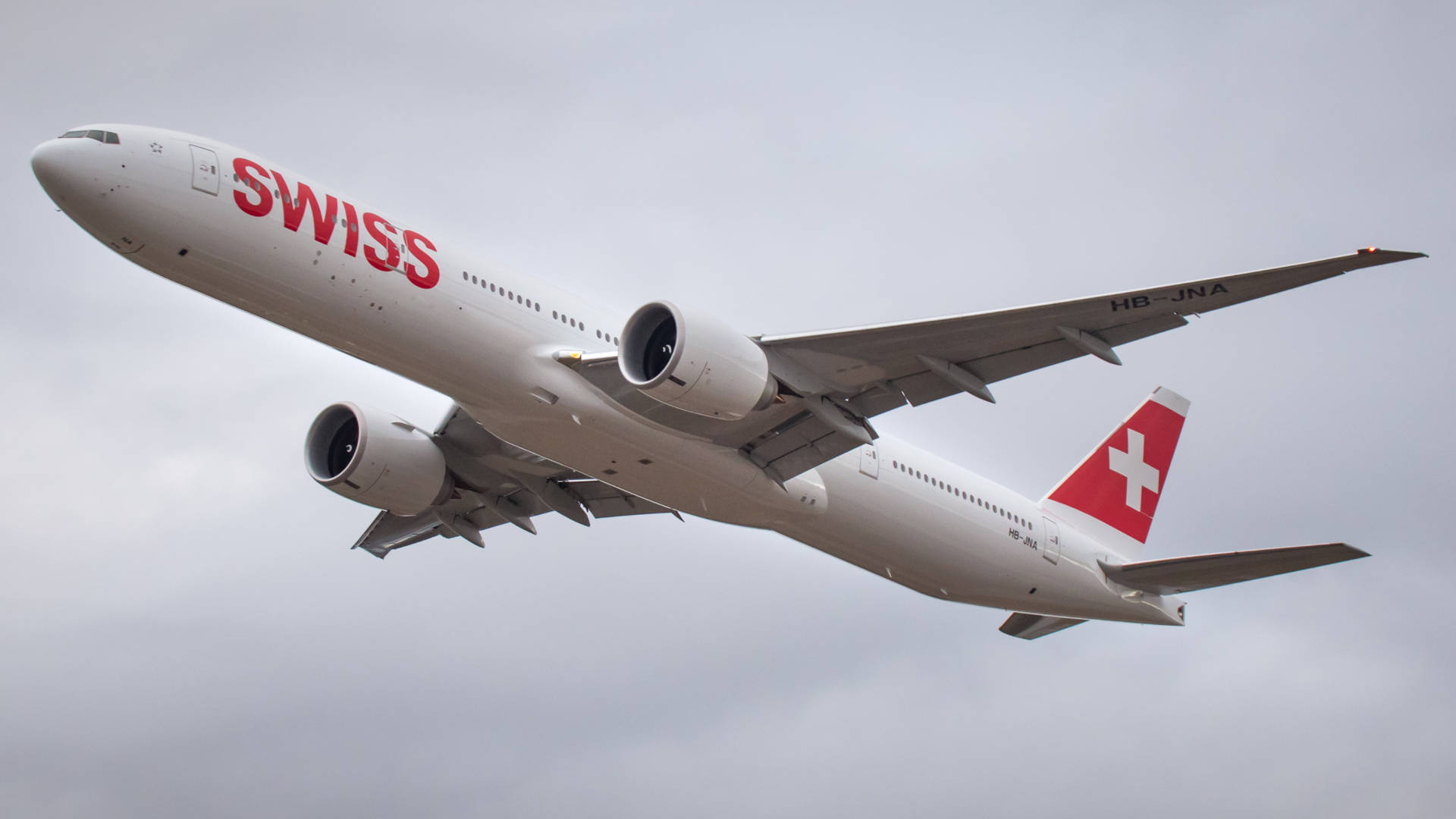 Swiss Airlines Under The White Clouds Background