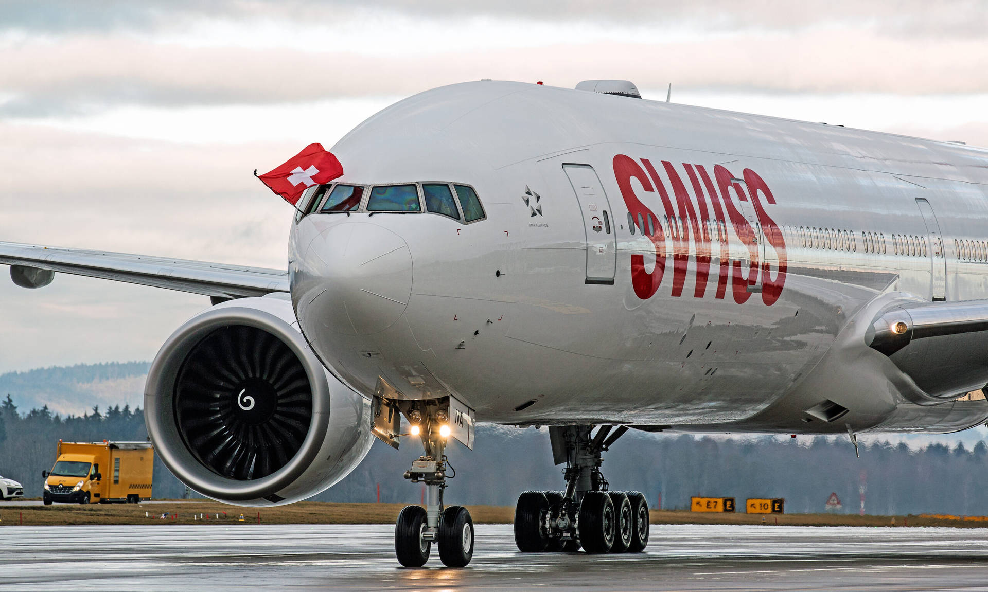 Swiss Airlines With The Flag Of Switzerland Background