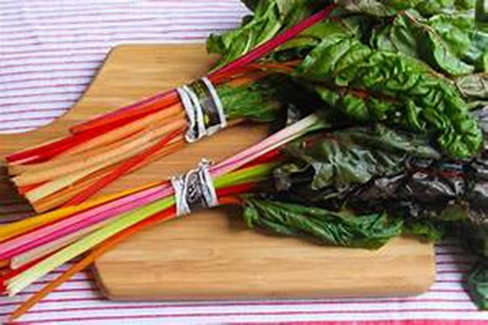 Swiss Chard Vegetables Striped Cloth Background