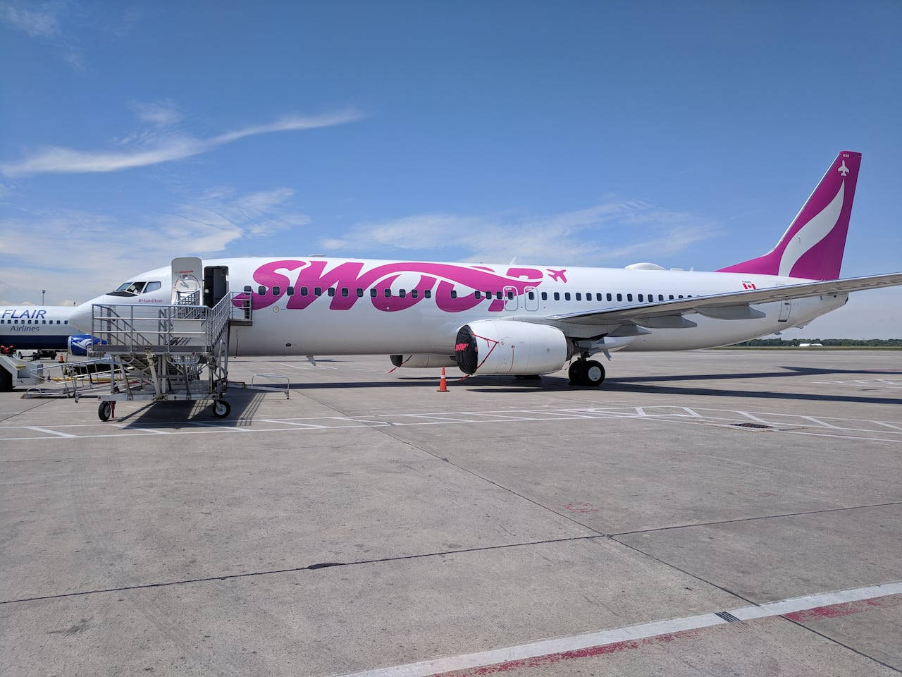 Swoop Aircraft Loading Passengers Background