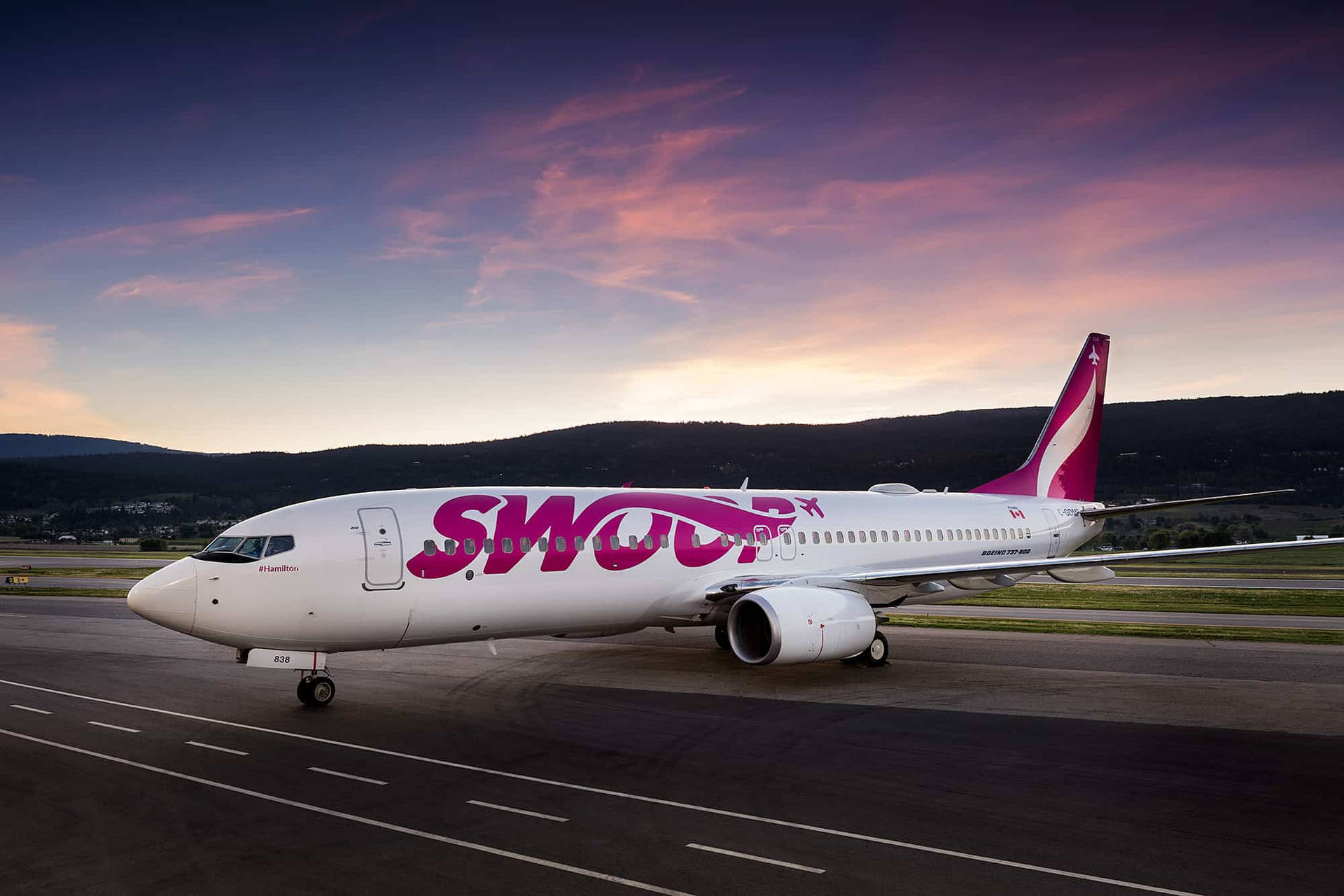 Swoop Airlines Plane At Runway Background