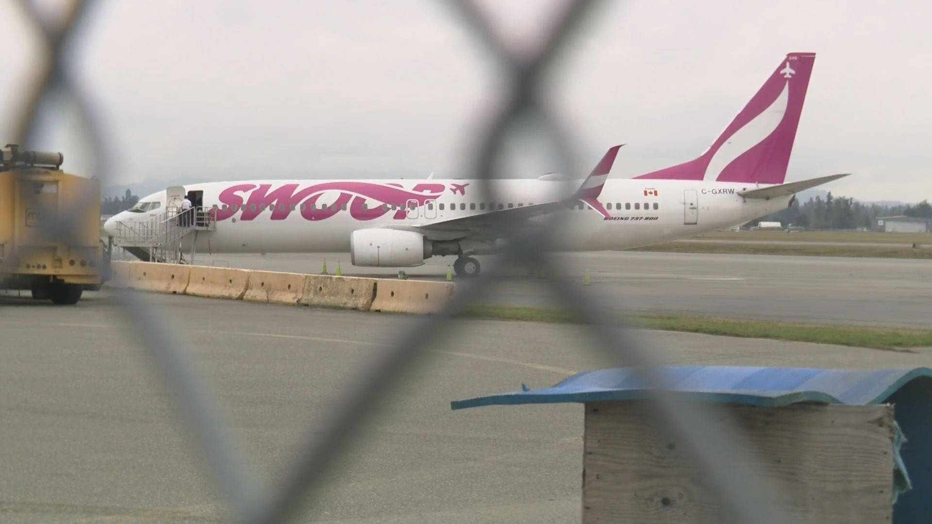 Swoop Airplane At Flight Ramp Background