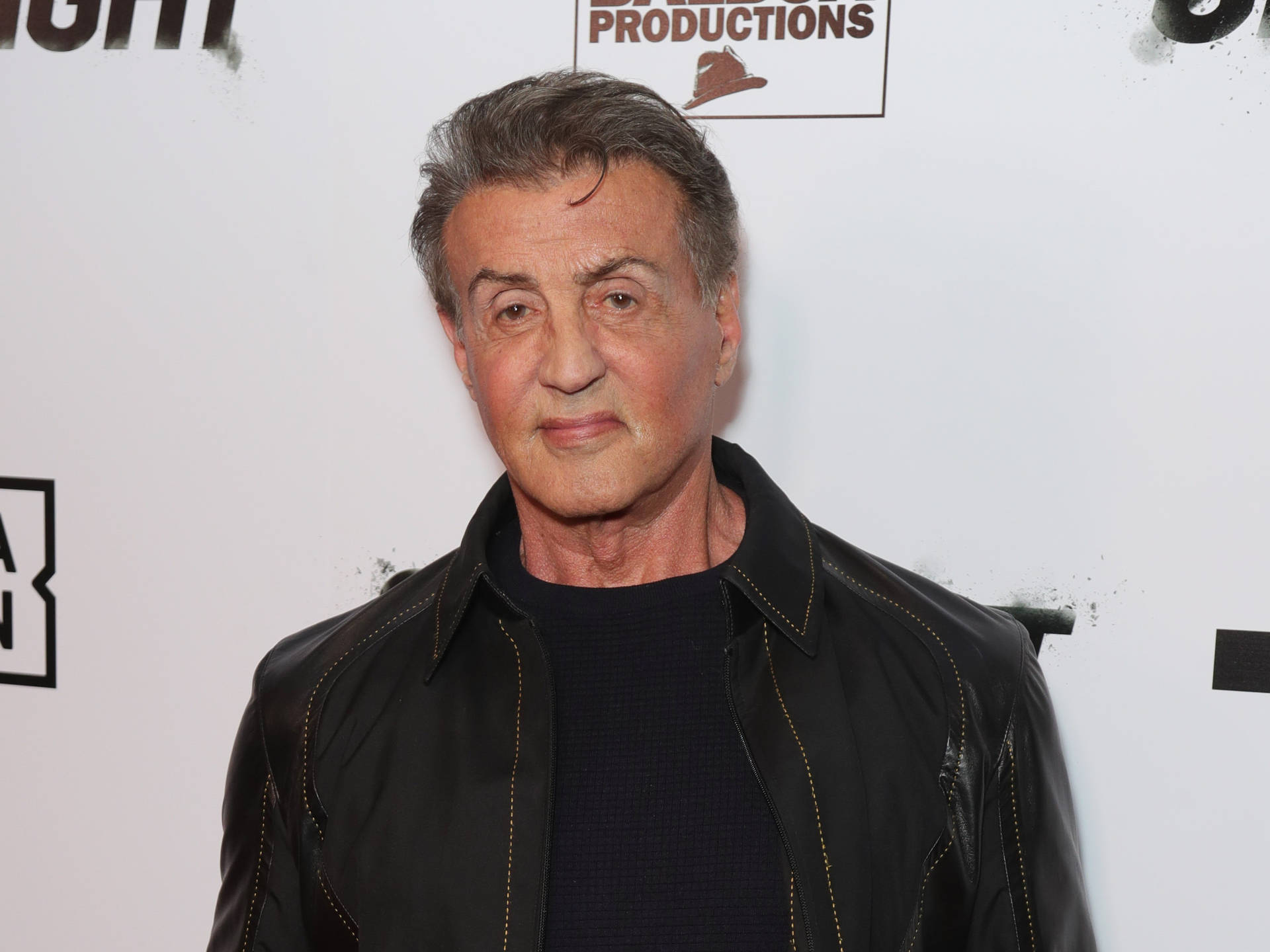 Sylvester Stallone Against White Wall Background
