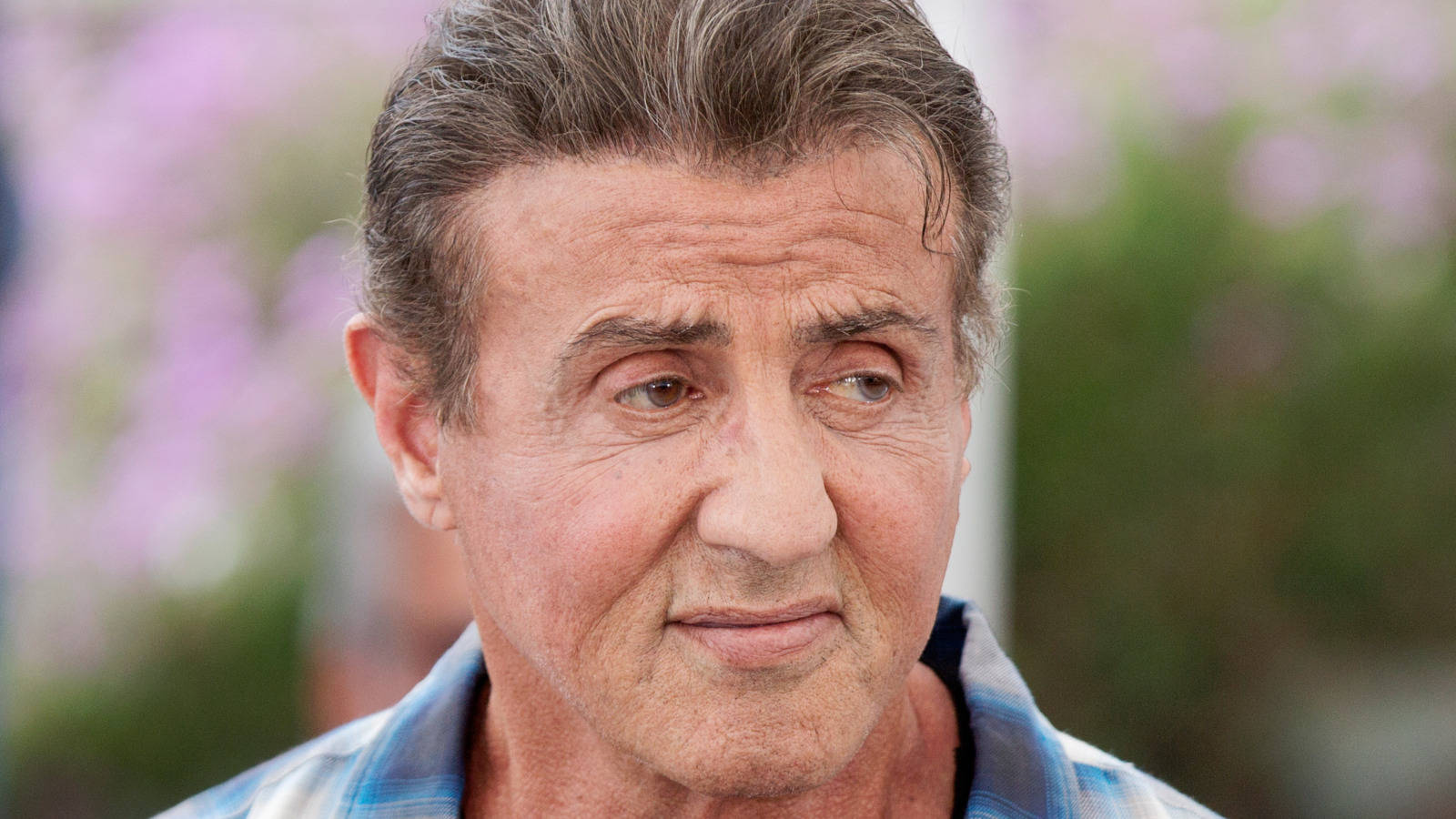 Sylvester Stallone Looks To Left Background