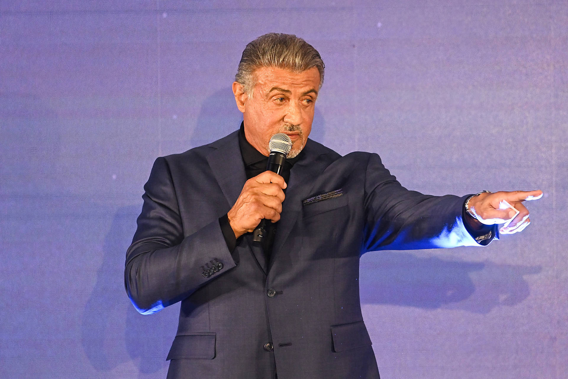 Sylvester Stallone Pointing Microphone Background