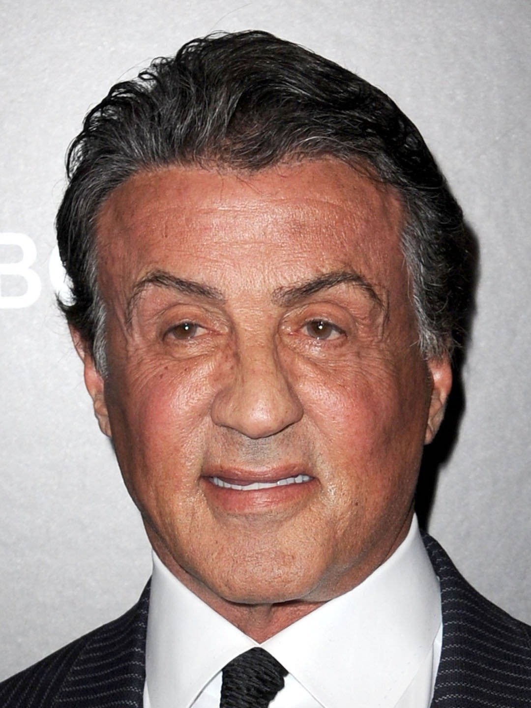 Sylvester Stallone Wearing Suit Background