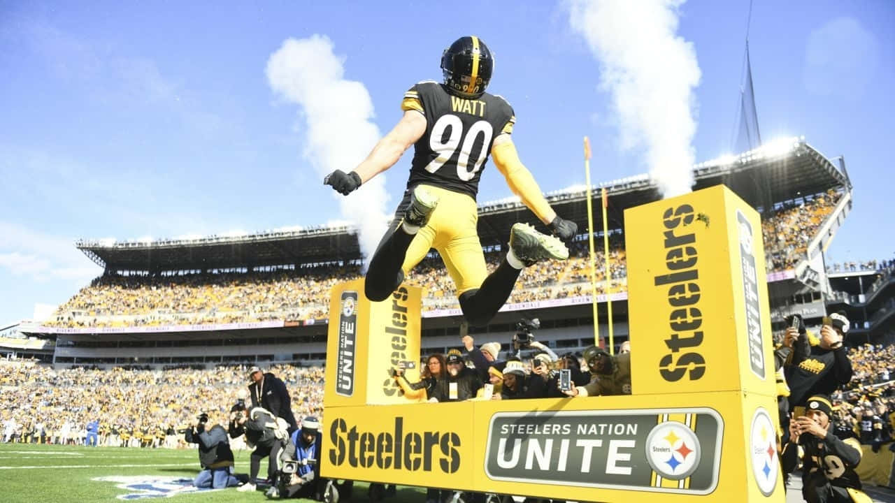 T.j. Watt Back View Jump Shot Background