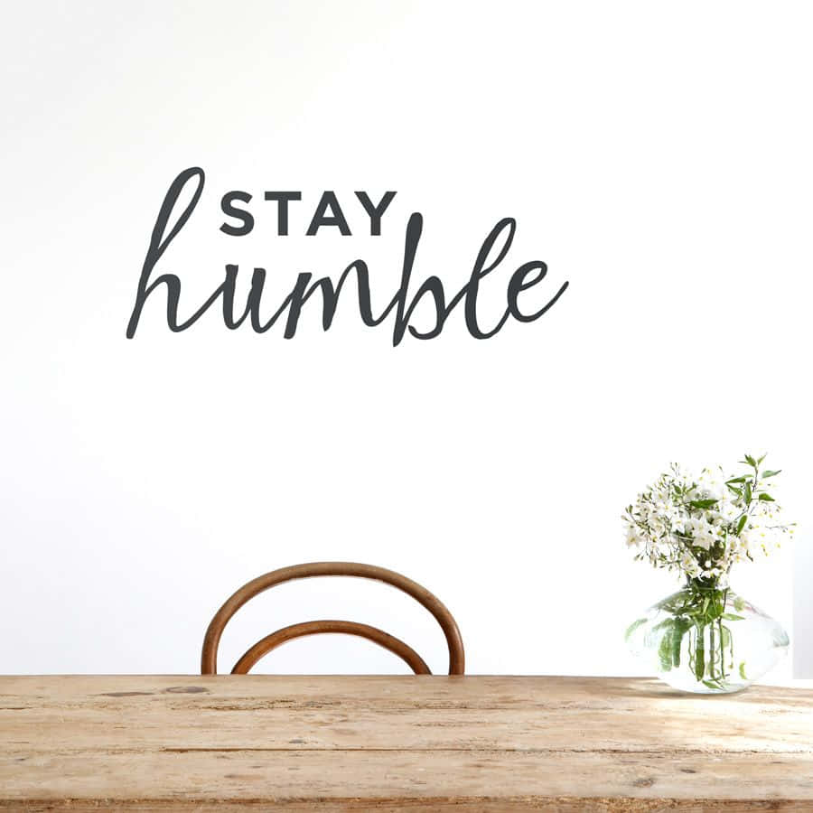 Table With A Stay Humble Quote Background