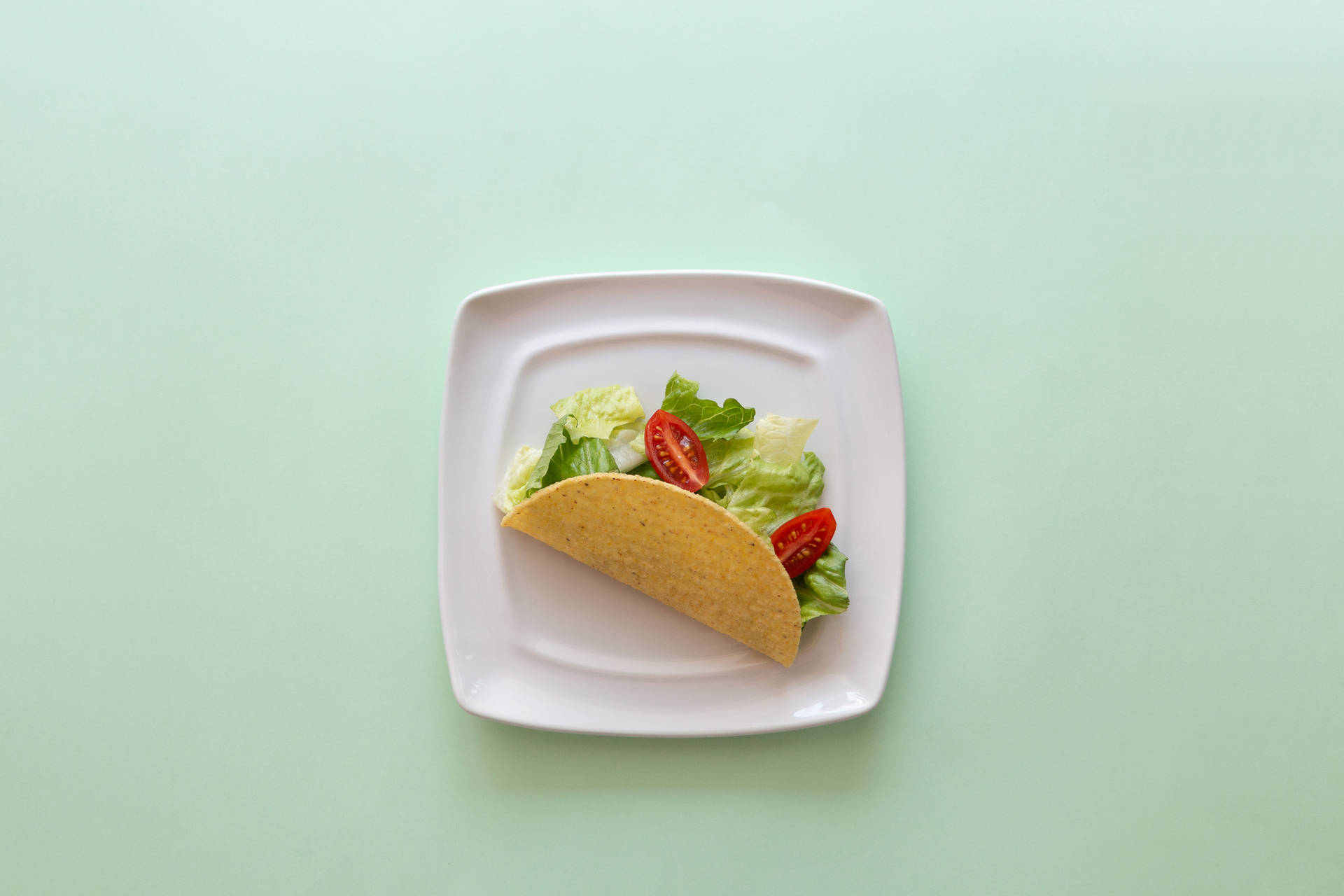 Taco On Pastel Green Table Background