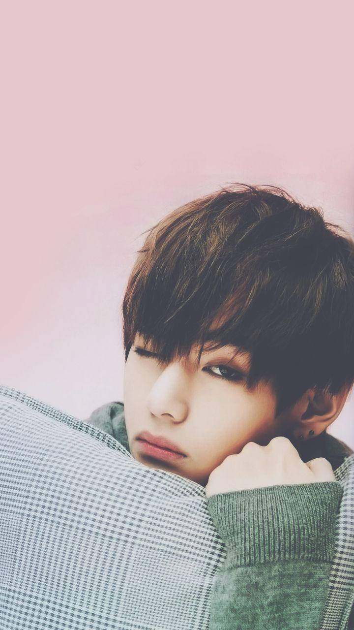 Taehyung Cute Hugging A Pillow Background