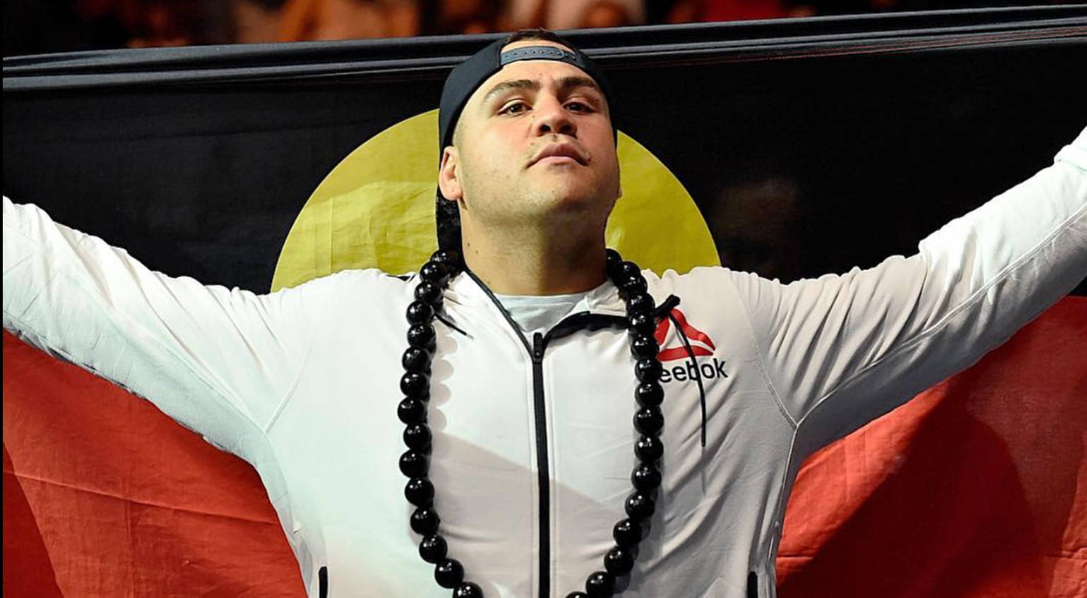 Tai Tuivasa Holding Flag From His Back