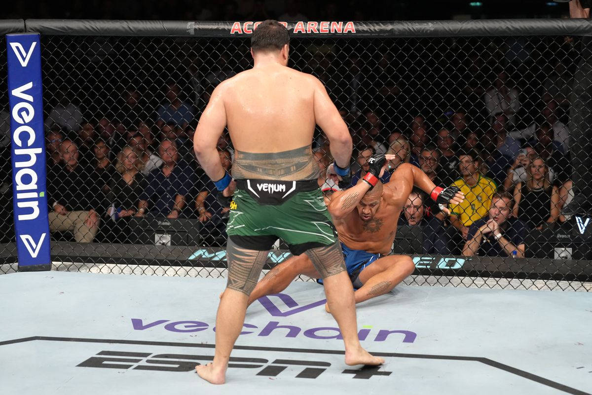 Tai Tuivasa Knocks Down Ciryl Gane Background