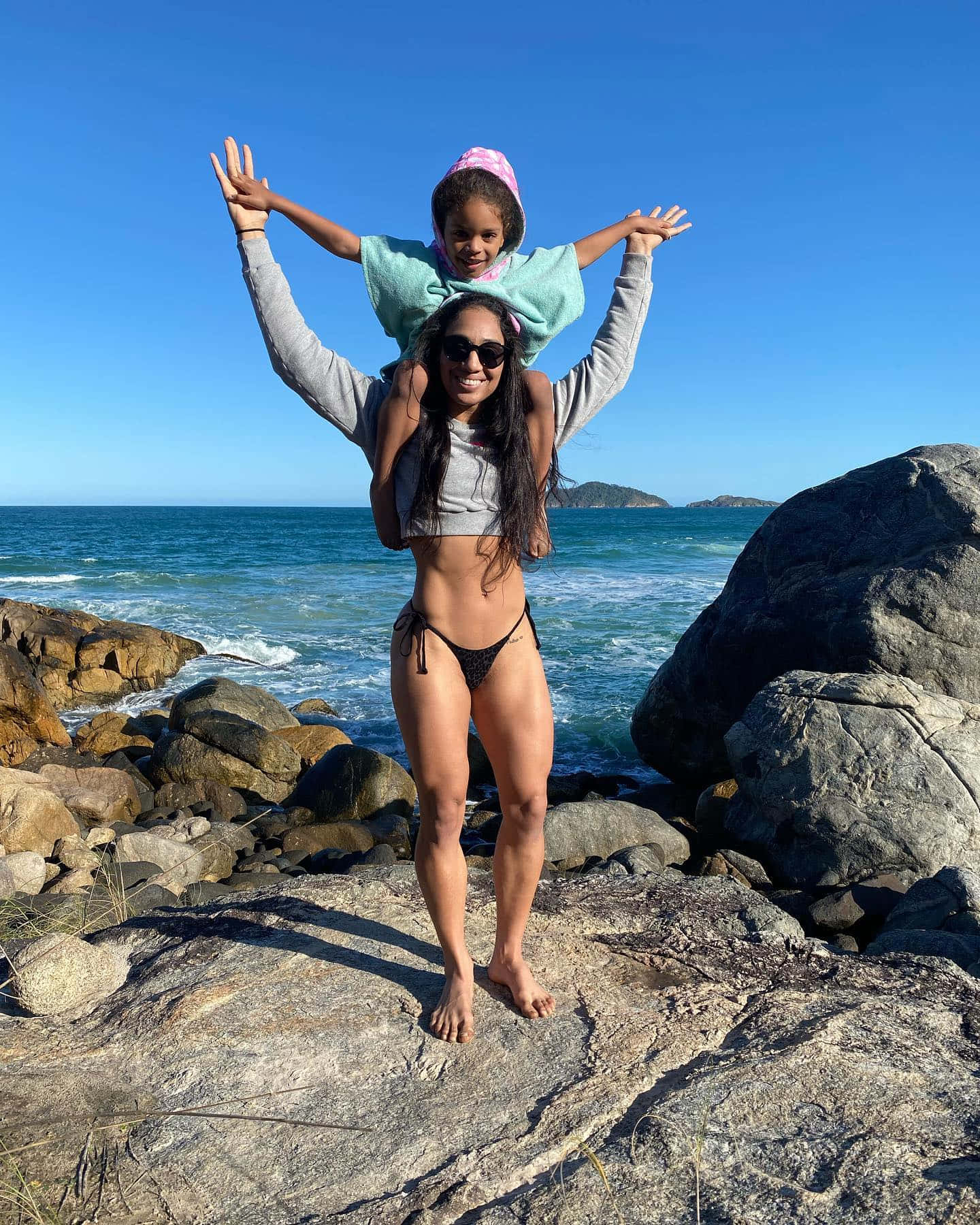 Taila Santos Carrying Daughter On Shoulders