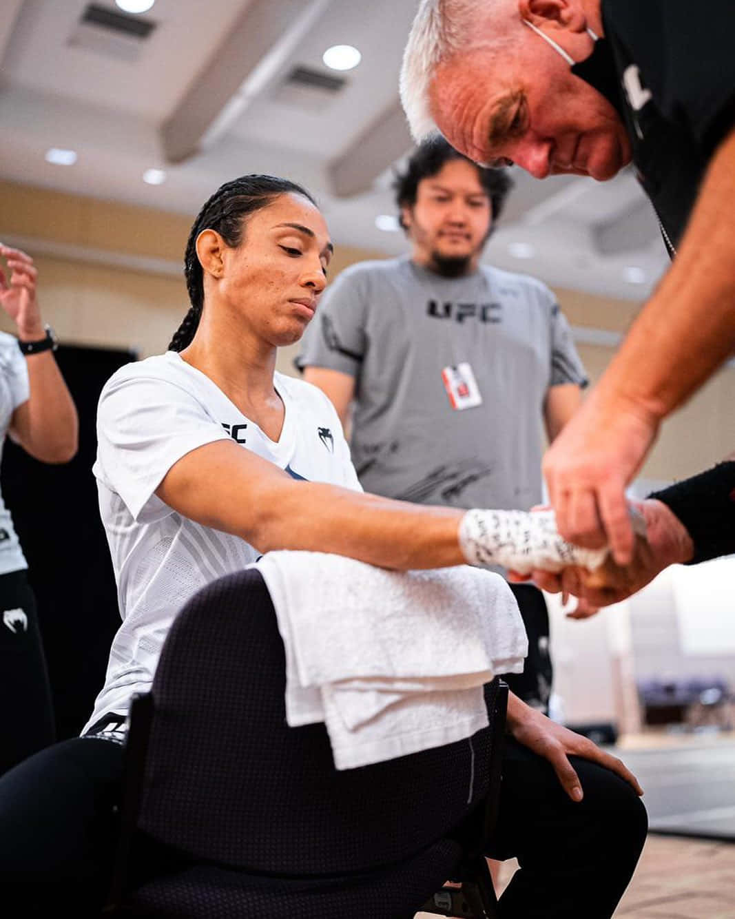 Taila Santos Sitting On Chair For Hand Wraps Background