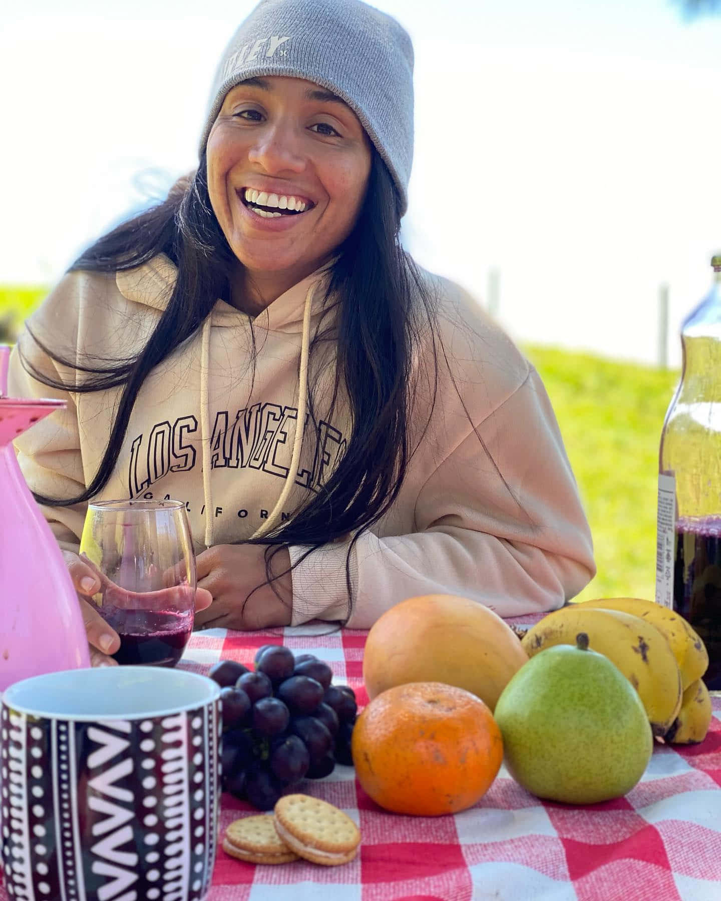 Taila Santos Smiling At Picnic Table