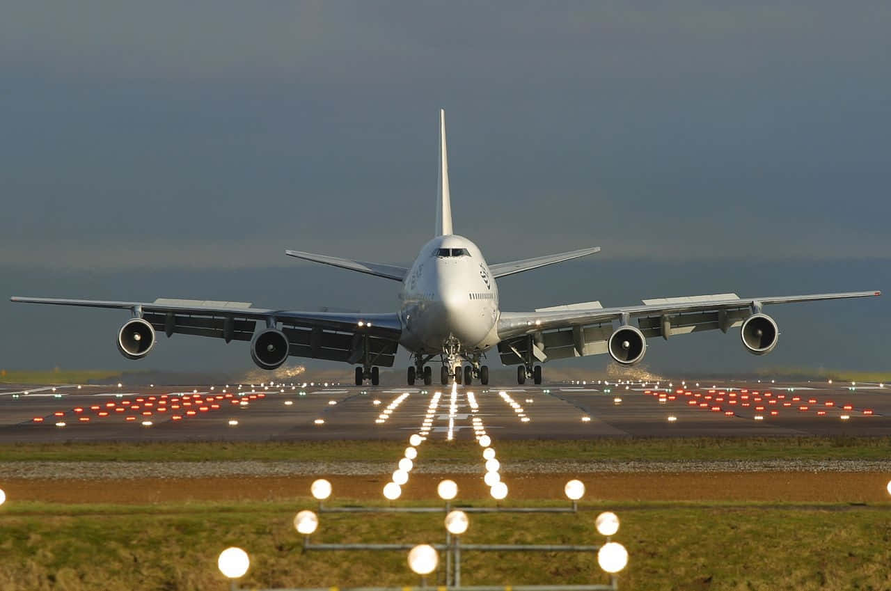 Take A Flight On A Giant Boeing 747 Airplane Background