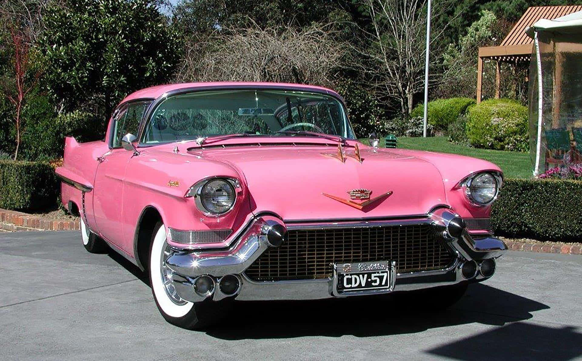 Take A Ride In This Gorgeous Pink Vintage Car Background
