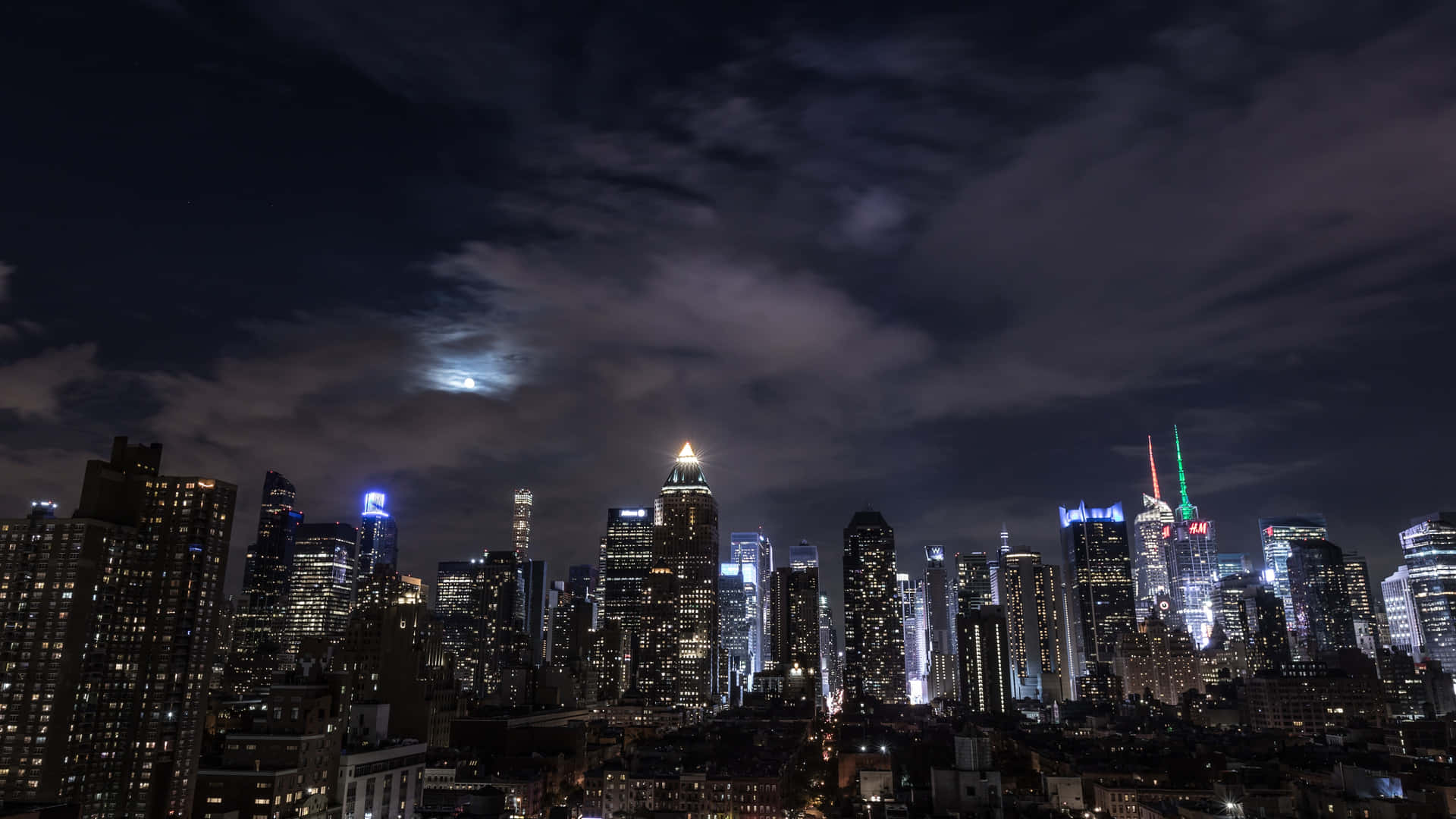 Take A Stroll Down The Bright And Bustling Streets Of New York City At Night Background