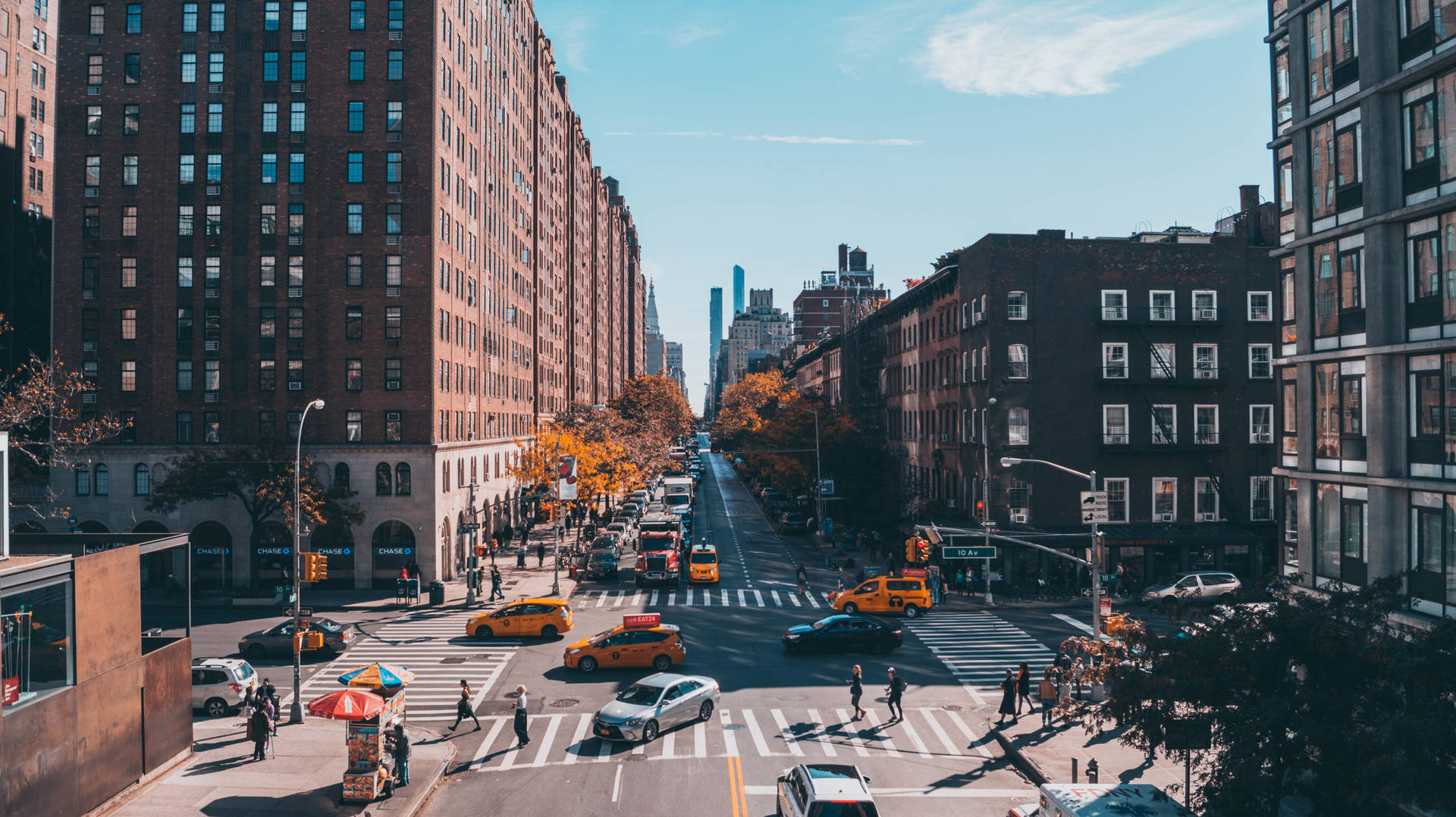 Take A Stroll Down This Lively New York Street Background