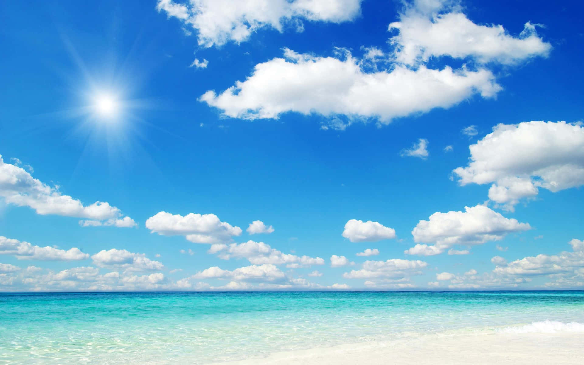 Take In The Beauty Of A Golden Beach Beneath A Majestic Sky Background