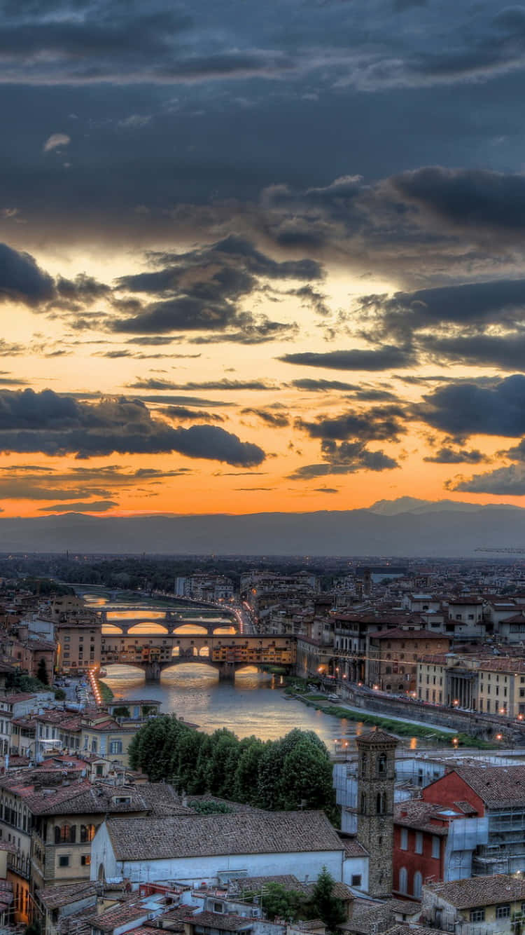 Take In The Beauty Of The City At Sunset Background