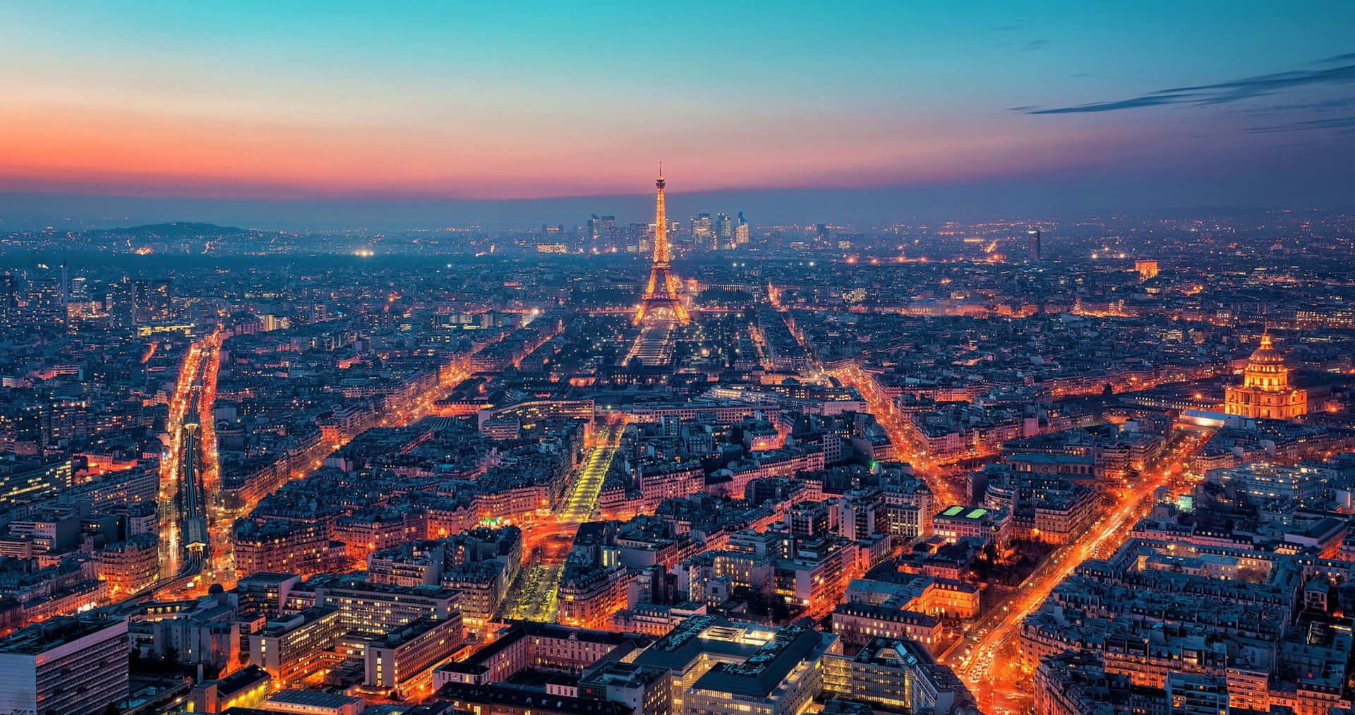 Take In The Evening City Lights Of Paris From A Rooftop View Background