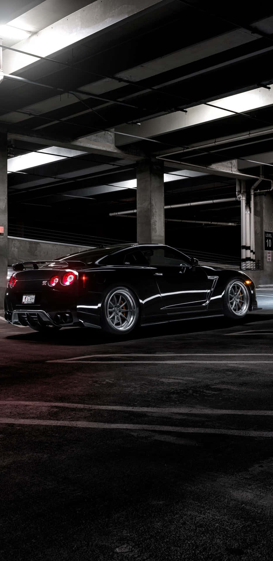 Take The Excitement Of The Nissan Skyline On The Road With The Iphone 8 Background