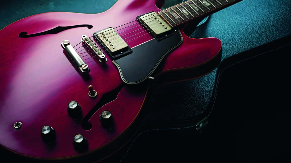 Take Your Creativity To The Next Level With The Gibson 335 Electric Guitar. Background