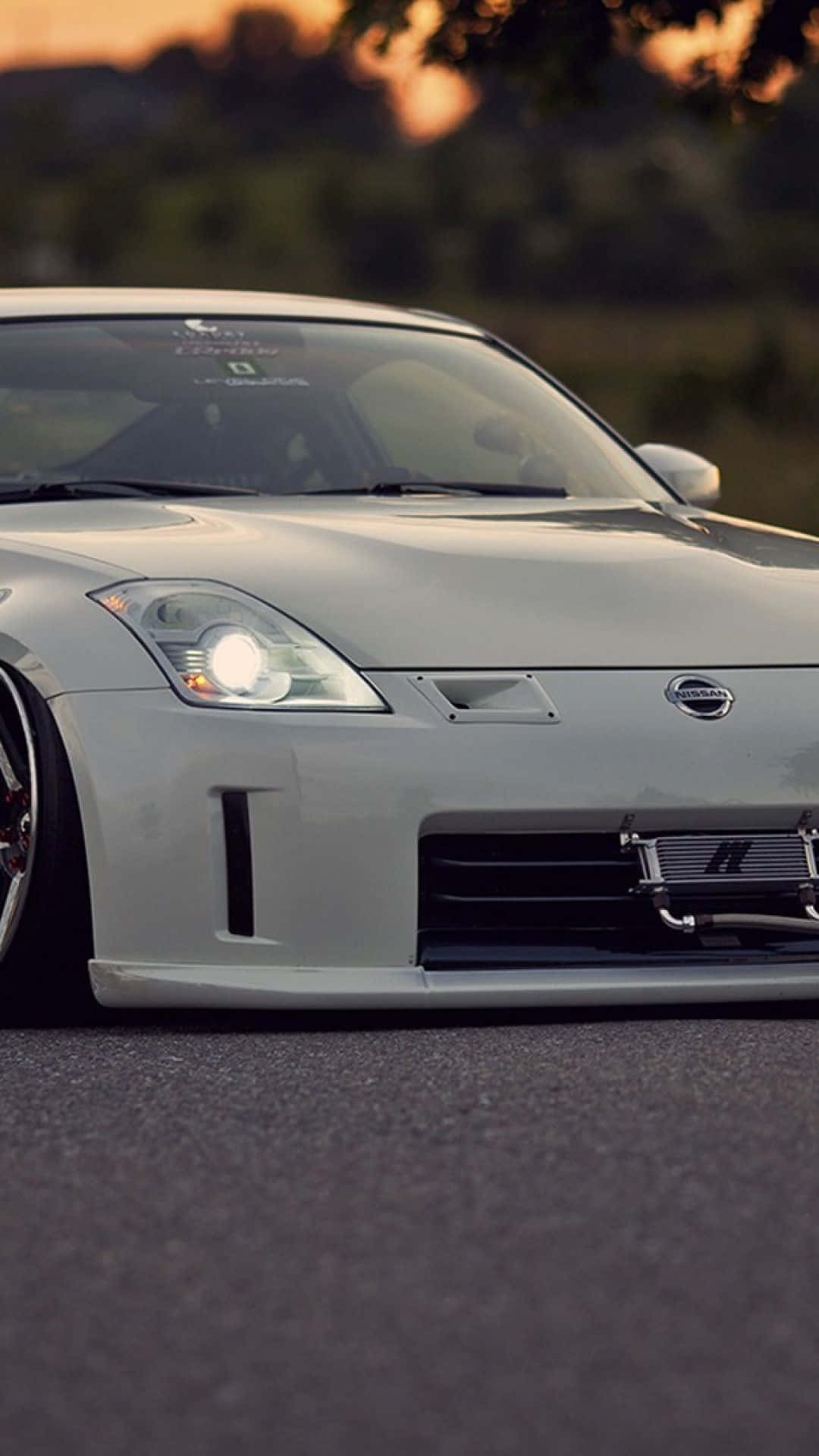 Take Your Driving Experience To The Next Level With The Nissan 350z! Background