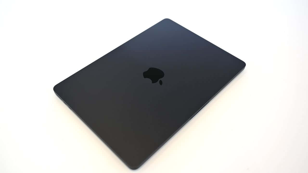 Take Your Work With You In Style With A Black Macbook Background