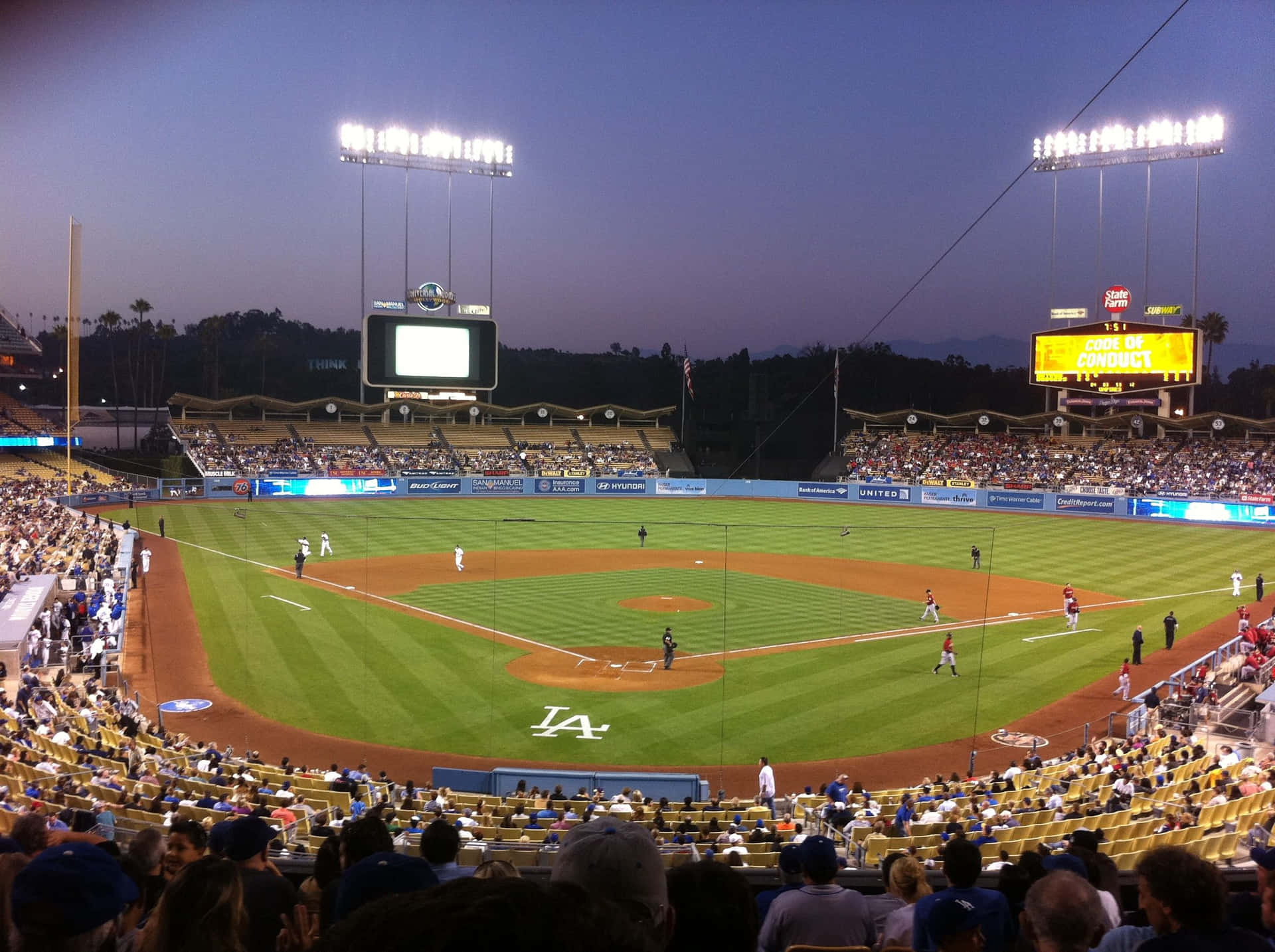Taking In A Ballgame At Dodger Stadium Background