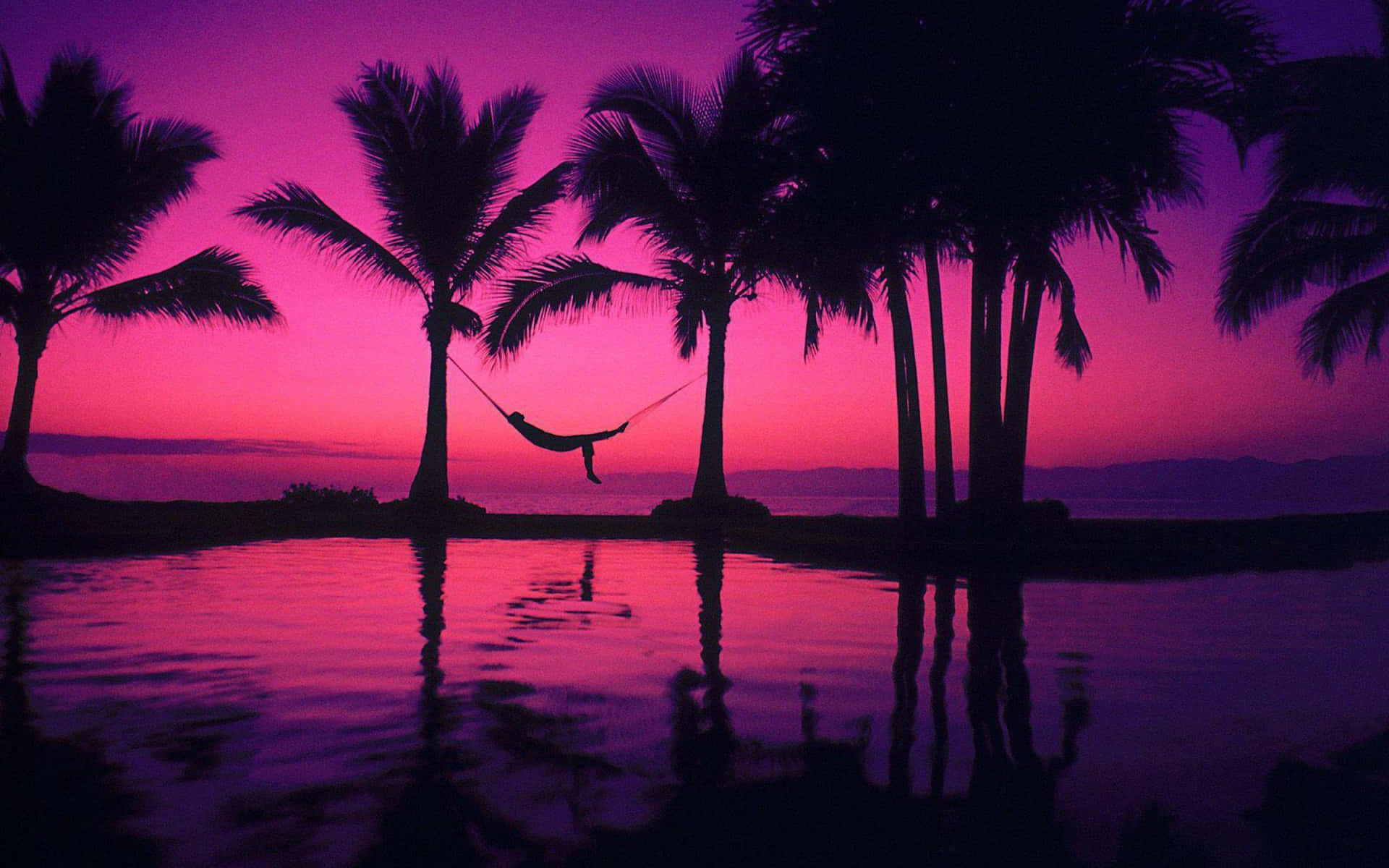 Taking In The Magical View Of A Pink Beach Sunset. Background