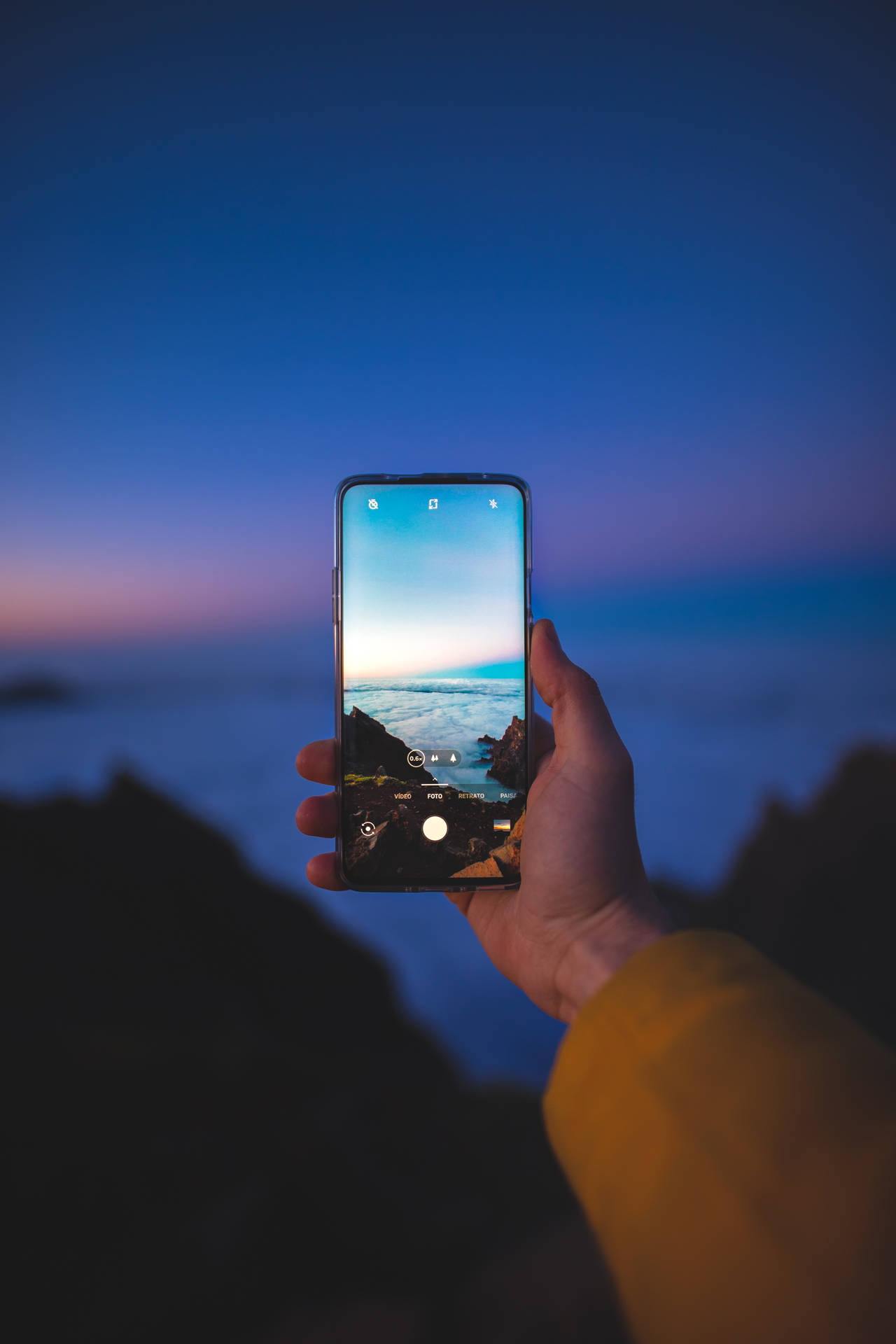 Taking Seaside Photo Using Phone Background