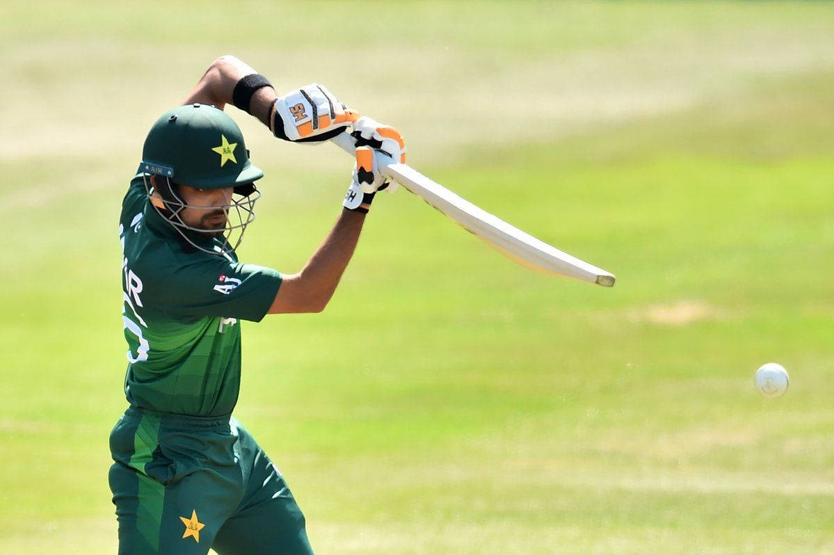 Talented Cricketer Babar Azam In Action Background