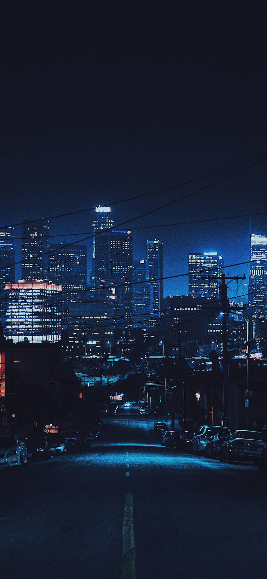 Tall Buildings At Dark Night Background