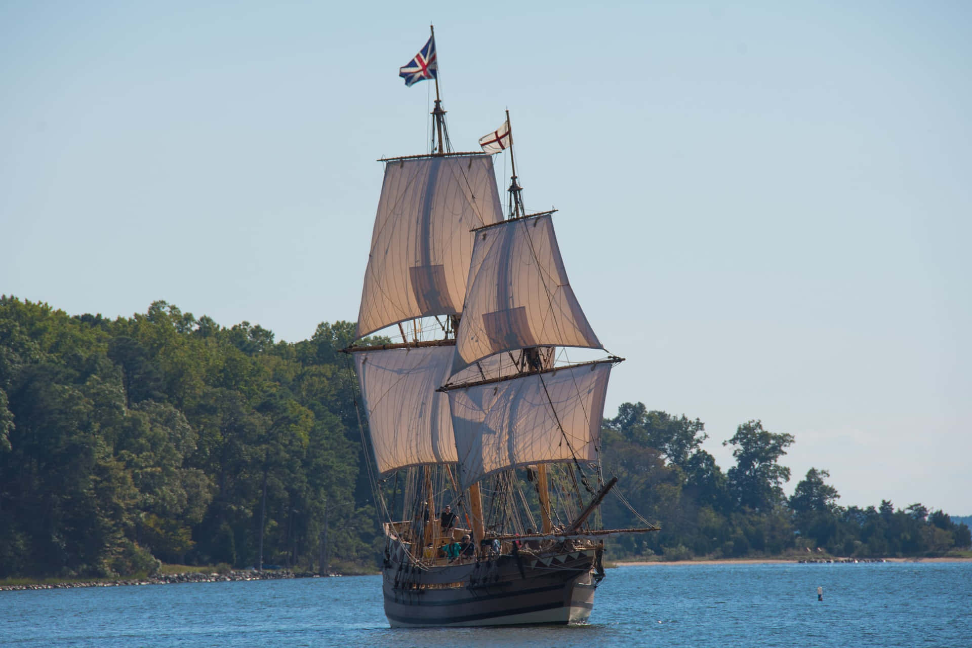 Tall_ Ship_ Sailing_on_ Calm_ Waters Background