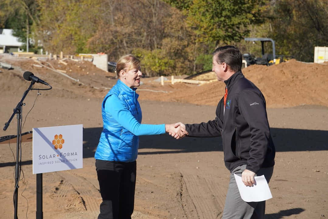 Tammy Baldwin Shaking Hands Background
