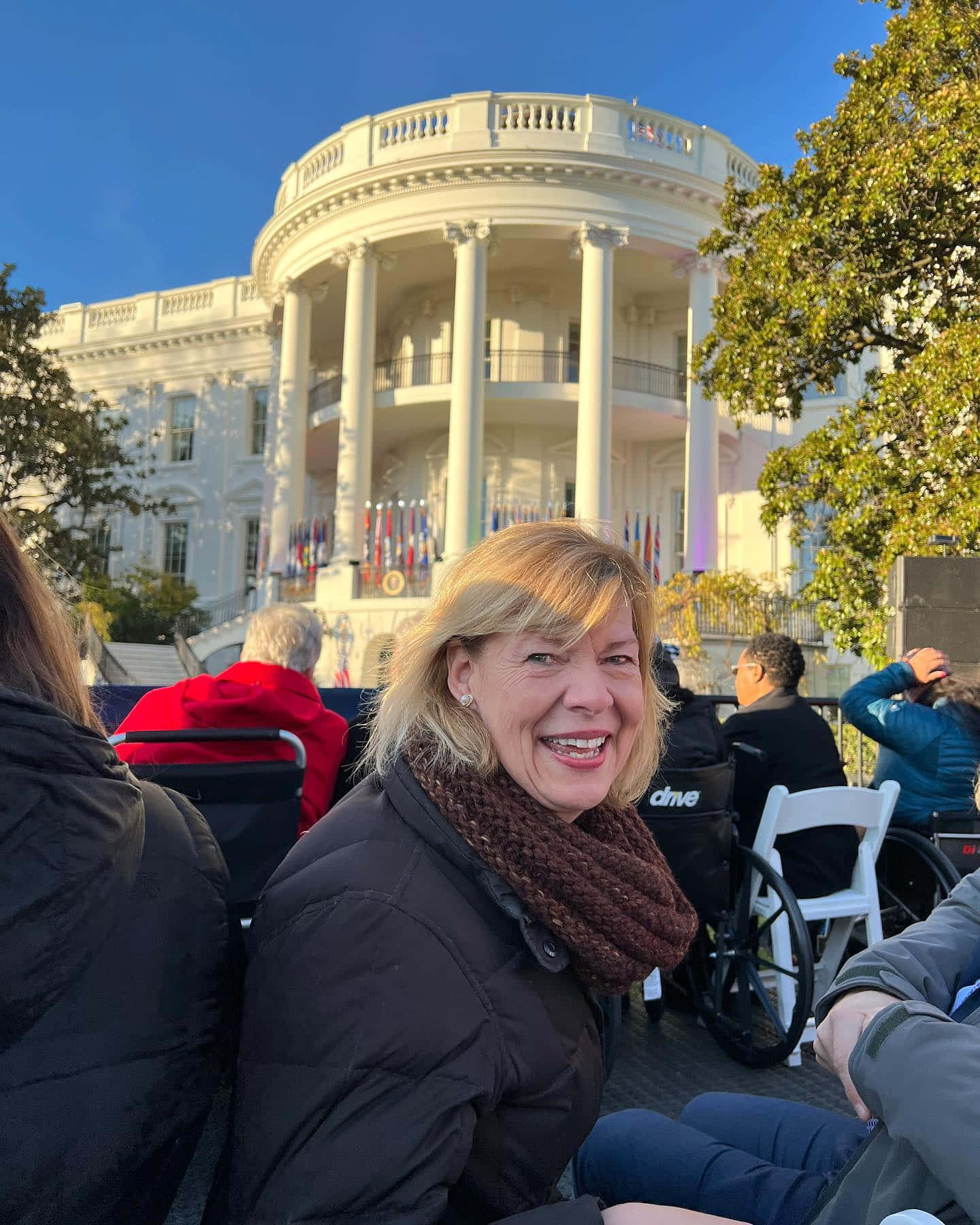 Tammy Baldwin Speaking At A White House Event Background