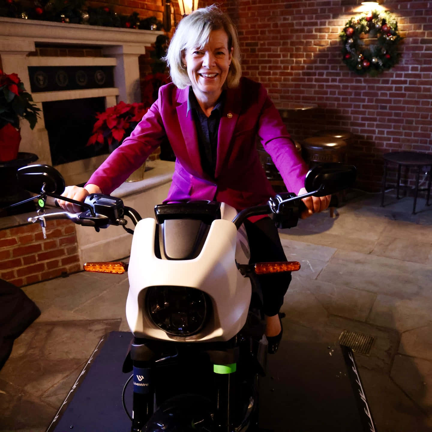 Tammy Baldwin With Motorcycle Background