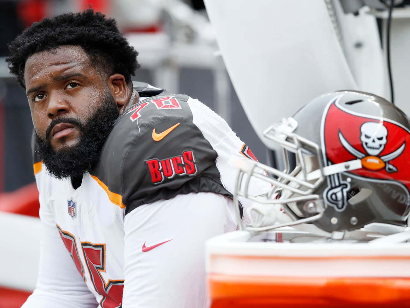 Tampa Bay Buccaneers' Offensive Tackle, Donovan Smith, Relaxing On Sidelines Background