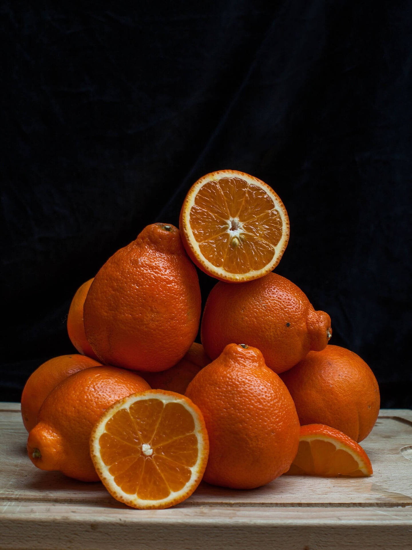 Tangelo Fruits On A Chopping Board Background