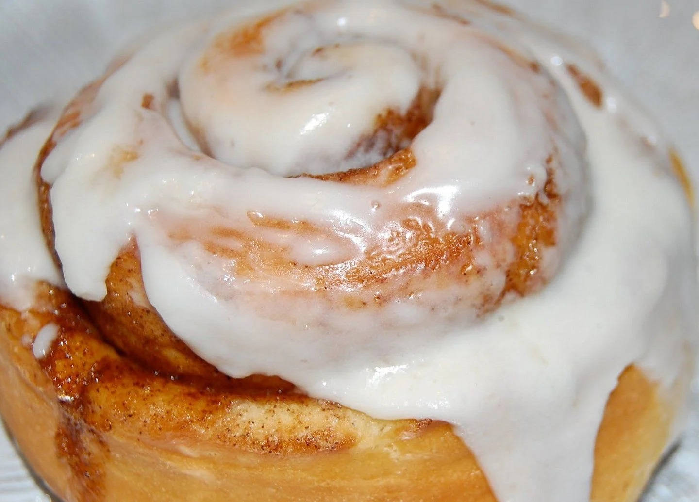 Tantalizing Cinnamon Bread With White Glaze Background