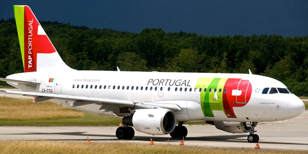 Tap Portugal Plane Near Forest Background