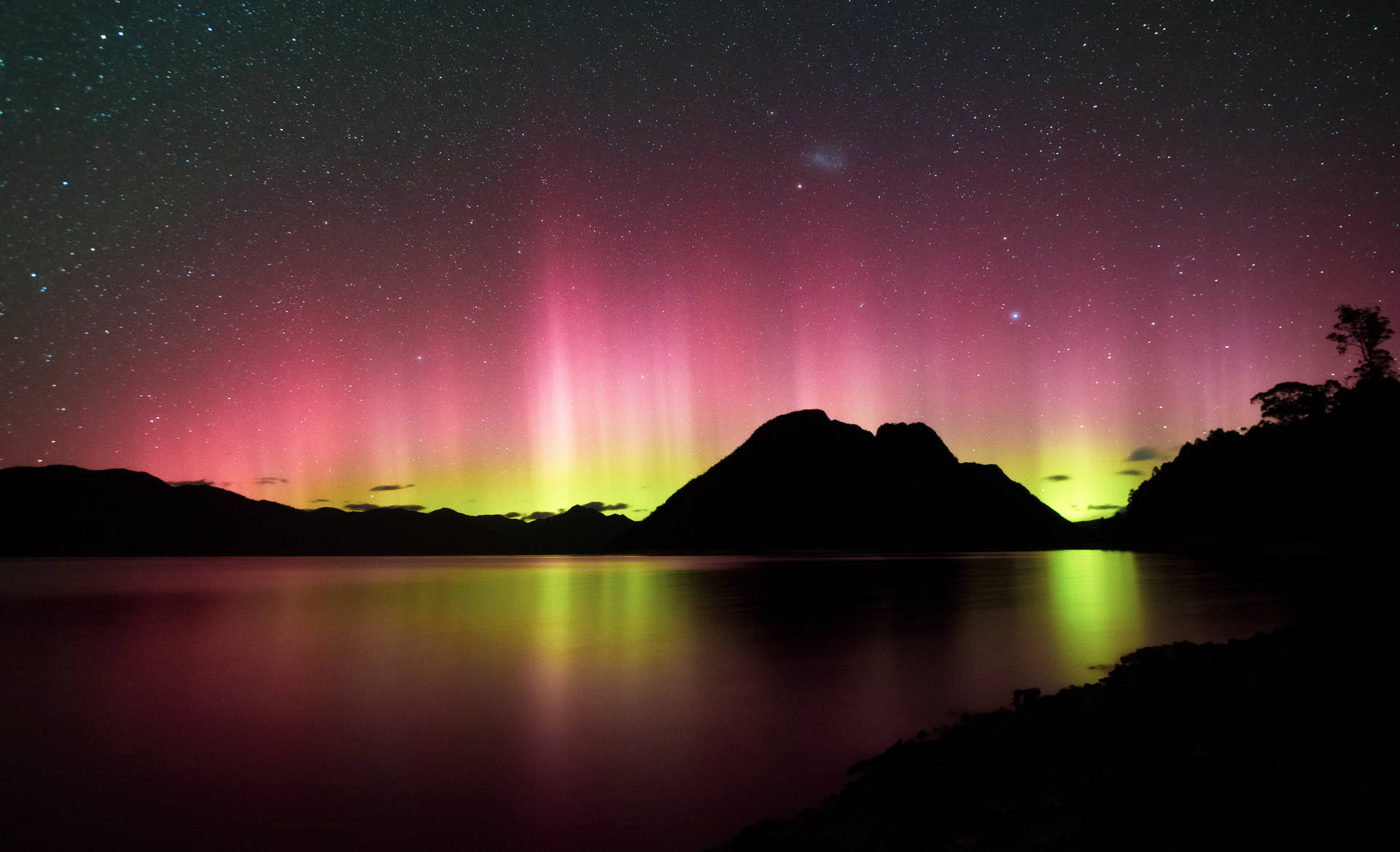 Tasmania Pink Yellow Aurora Lights Background