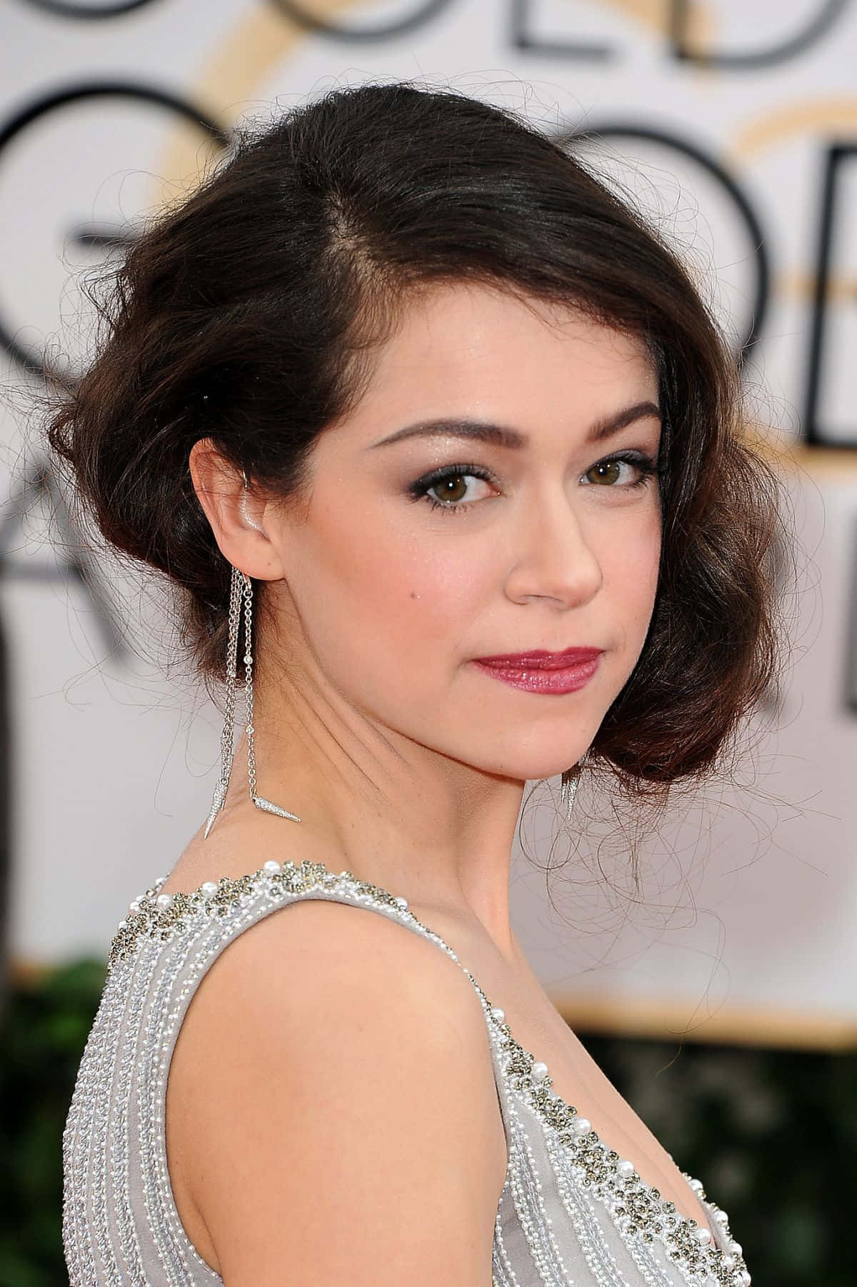 Tatiana Maslany Elegant Red Carpet Look Background