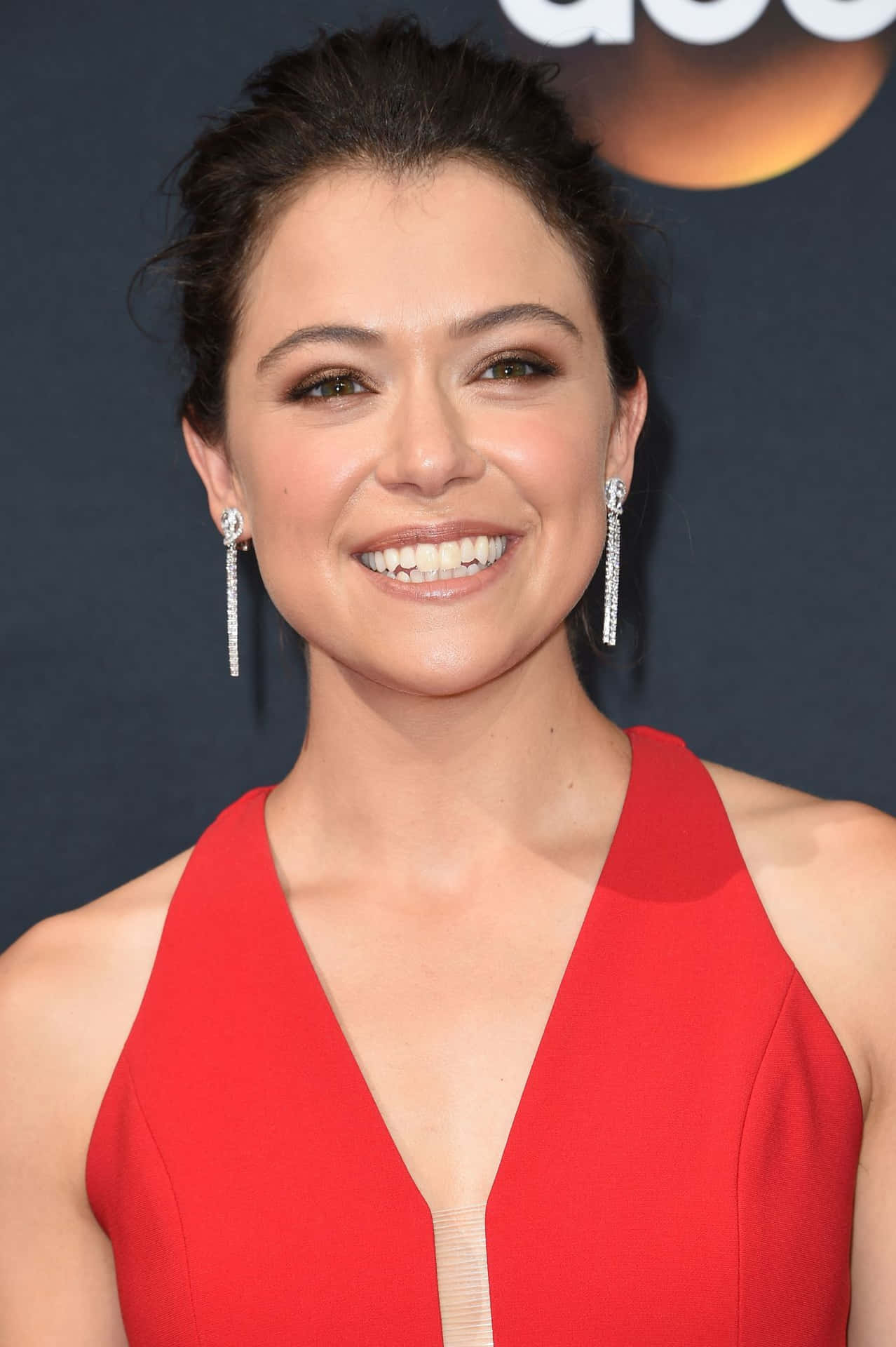 Tatiana Maslany Red Dress Event Background