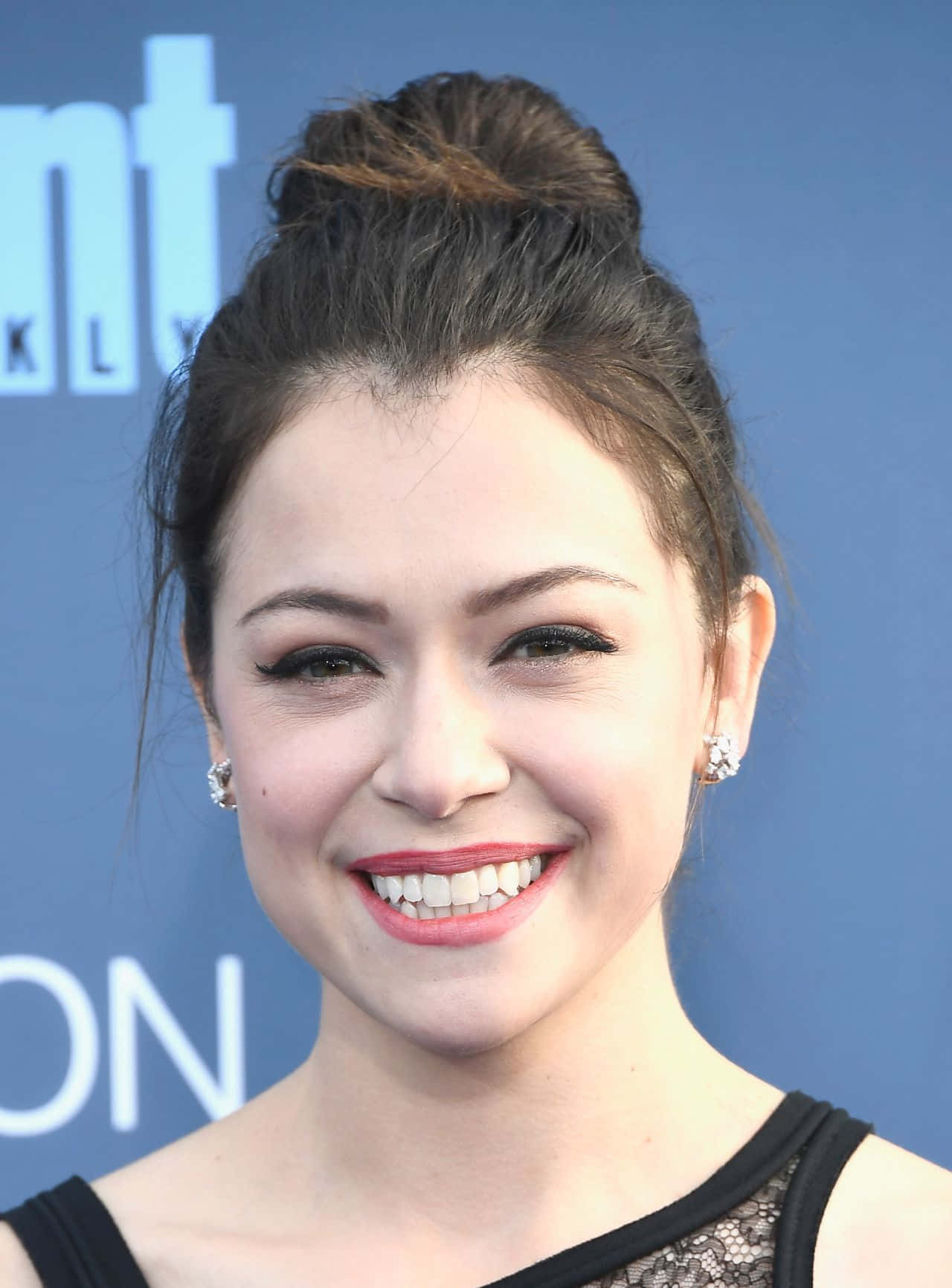 Tatiana Maslany Smiling Red Carpet Event Background