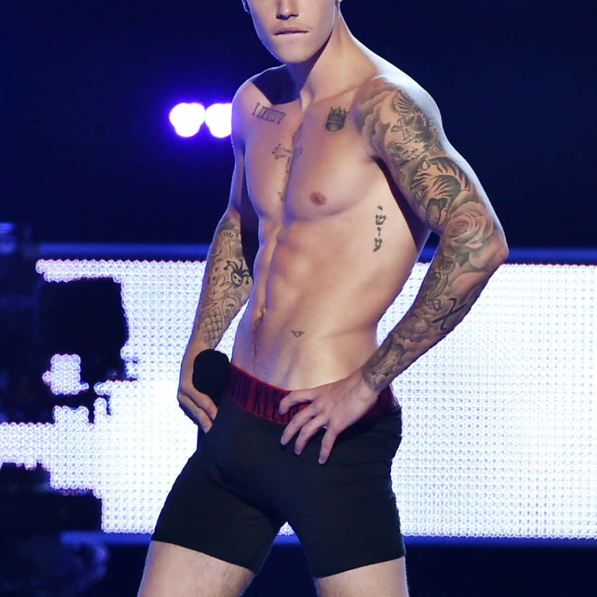 Tattooed Hot Teen Boy On Stage Background